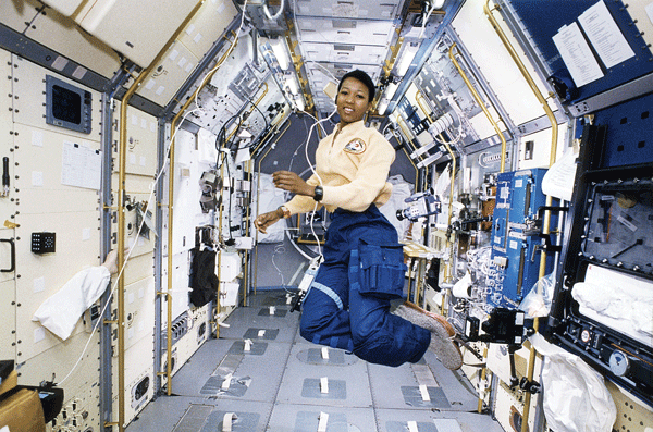 Mae Jemison, MD, (a general practitioner) floats in zero gravity at the Spacelab Japan Science module aboard STS-105, Endeavour. 